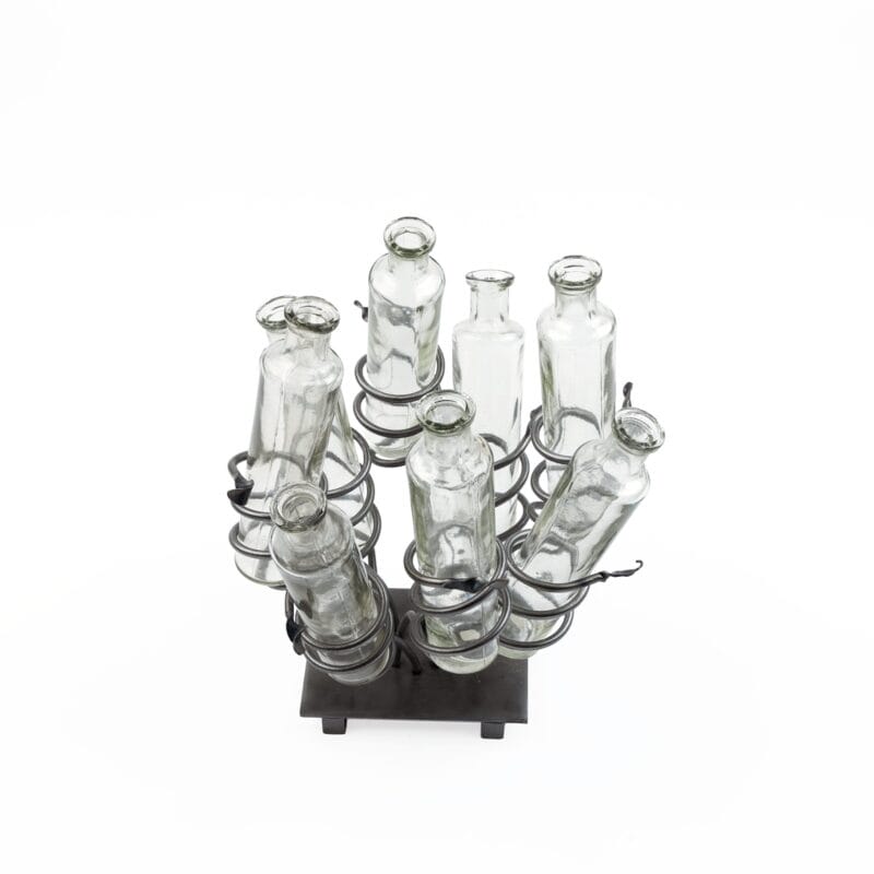 Idée Art Exclusive. A Set of 8 Glass Bottles With Metal Stand. Large Size