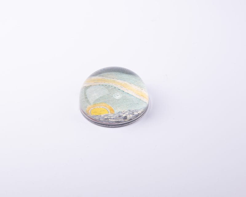 John Derian. Dome Paperweight with Sun Illustration