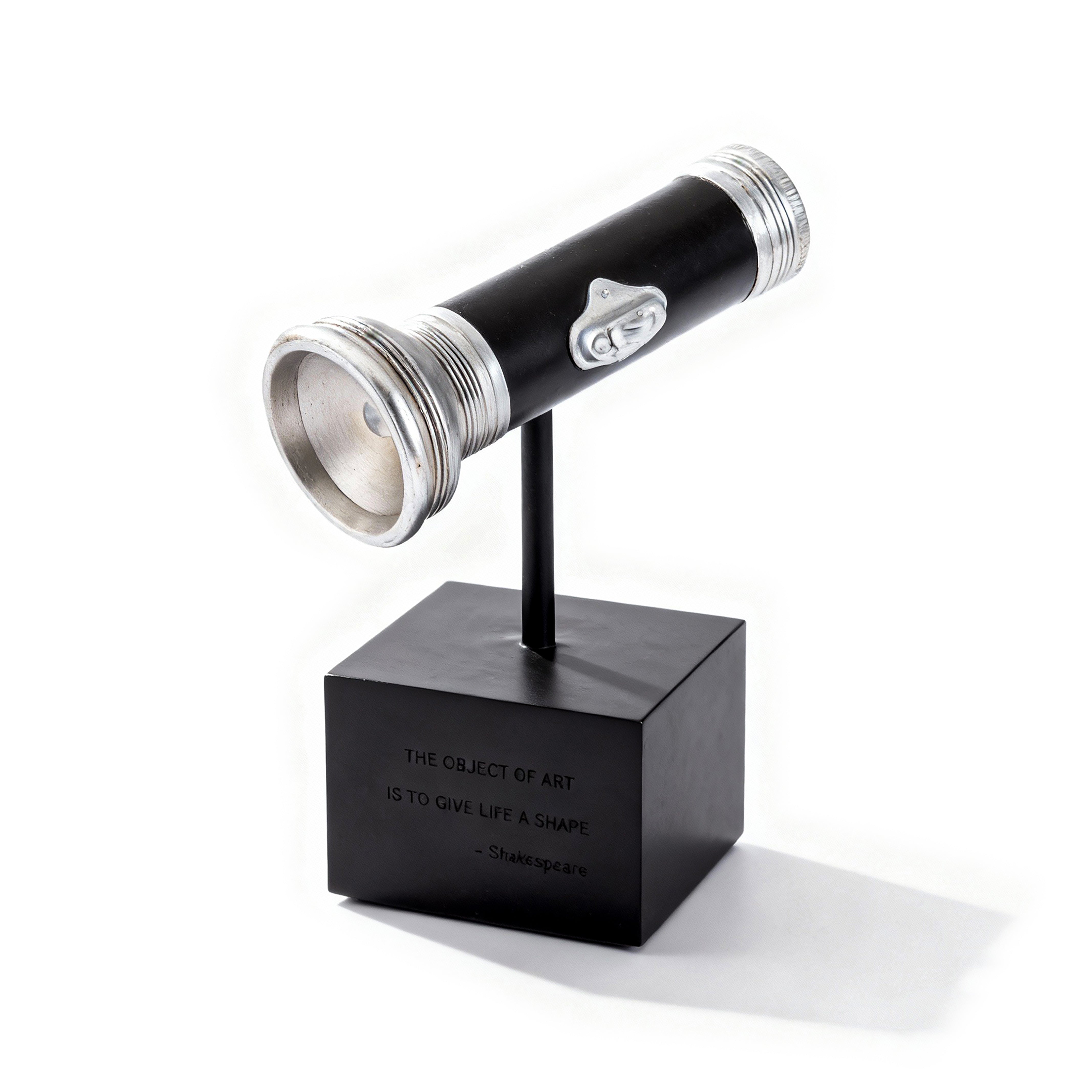 The Merchant Source. Black Flashlight Sculpture