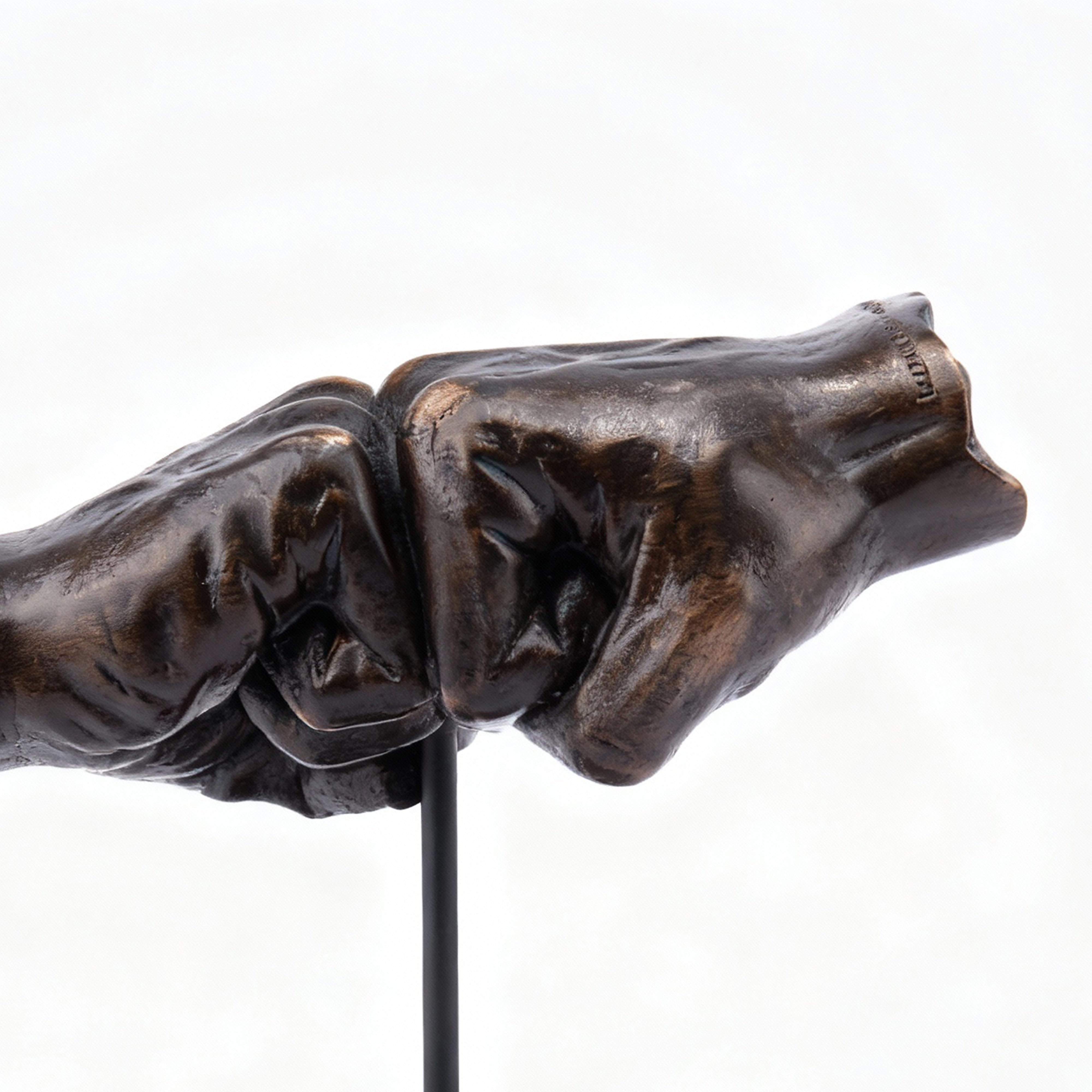 The Merchant Source. Fist Bump Sculpture