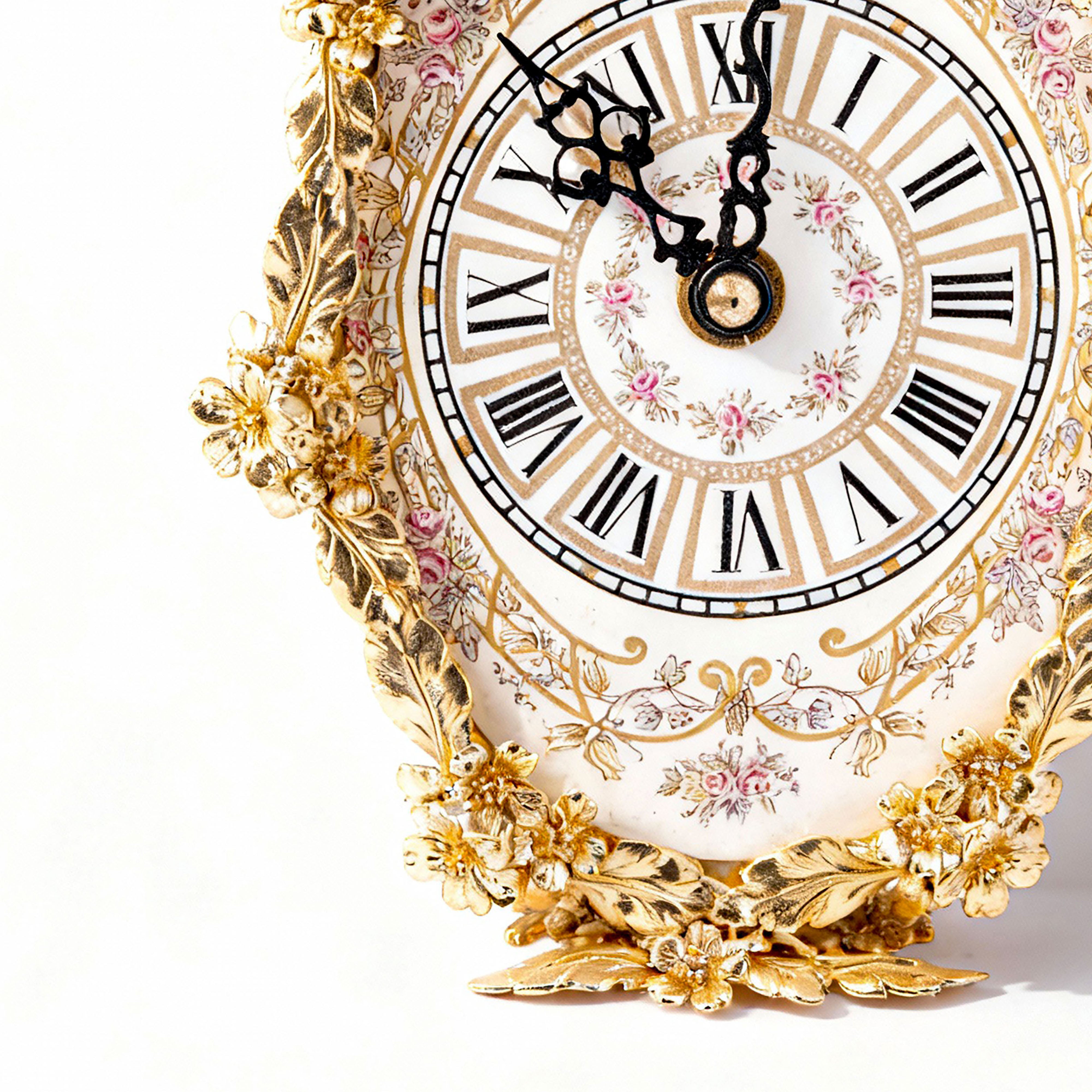 Artistiche Ceramiche Fiorentine. Gilded Oval Clock with Floral Motifs. Medium Size