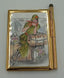 Personalized Expressions. Gold Plated Memo Pad with a Pen Featuring a Traveling Lady