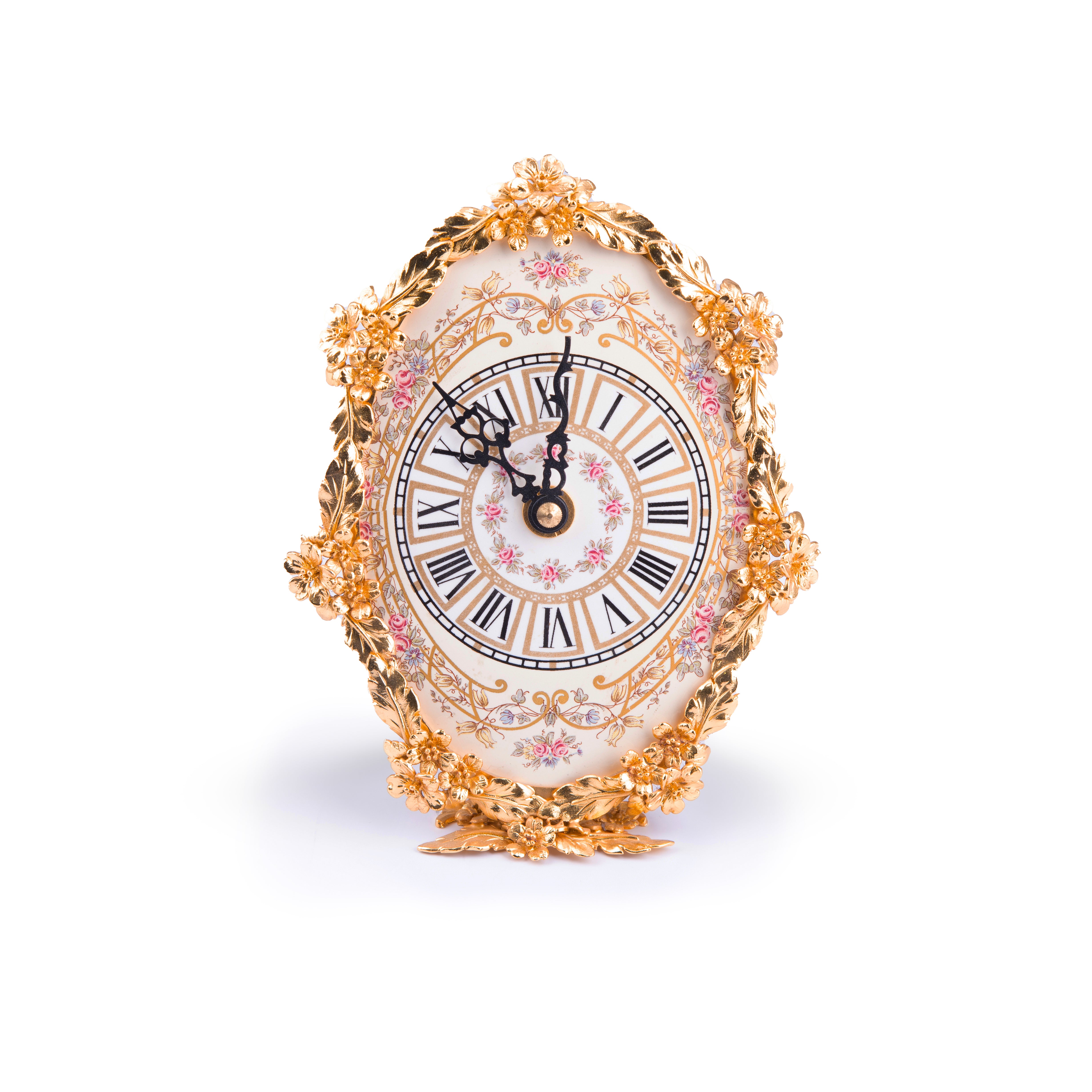 Artistiche Ceramiche Fiorentine. Gilded Oval Clock with Floral Motifs. Medium Size